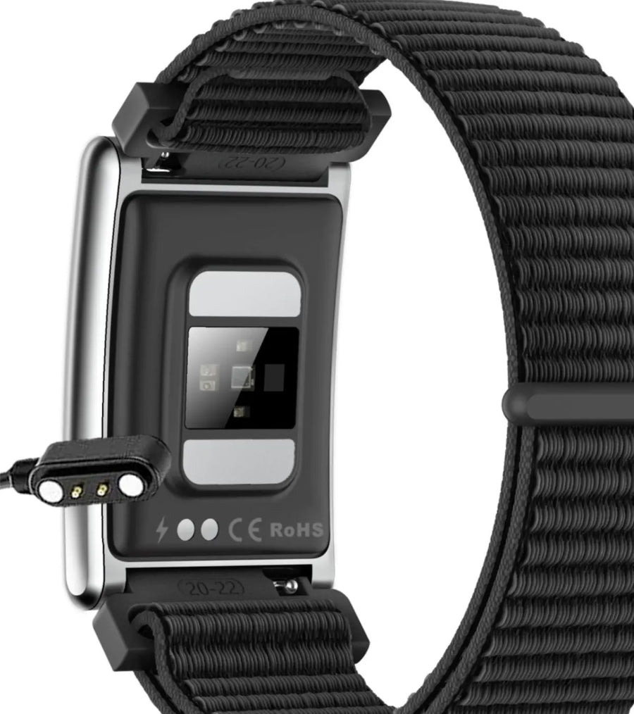 Magnetic charger lined up with the charging pins on the band